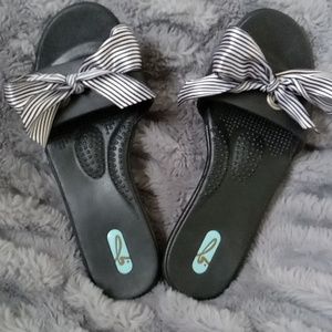 Black OKA b slip on sandals with black and white striped ribbon. Never worn. But